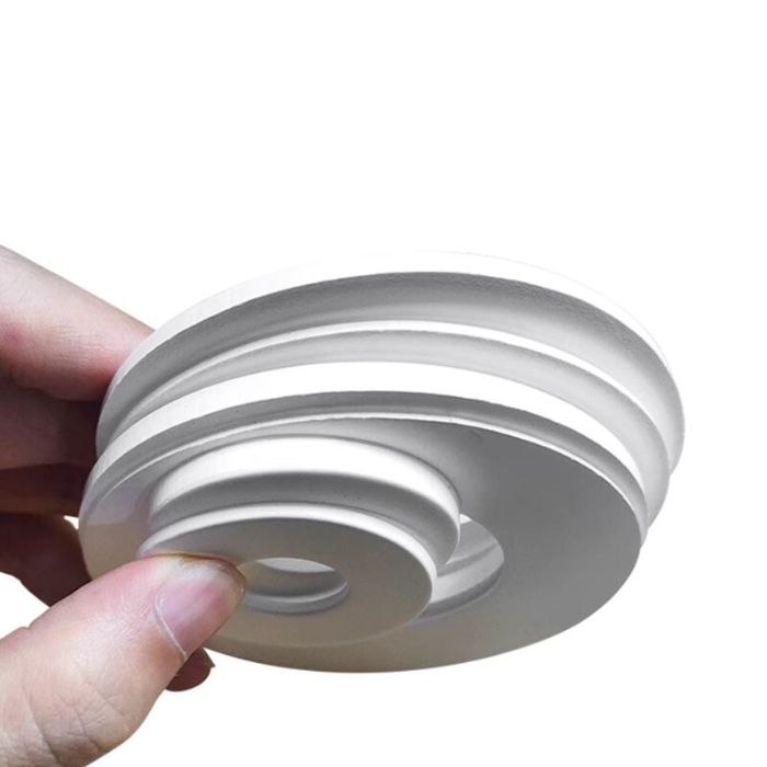 Expanded PTFE gasket Hand holding a stack of expanded PTFE in different sizes