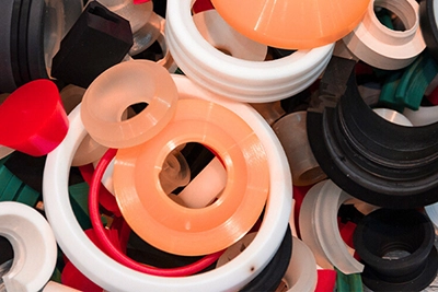 Several different types of polyurethane gaskets are in a pile.