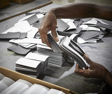 Hand holding a stack of recently-cut seals