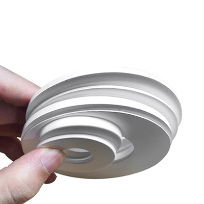 Expanded PTFE gasket Hand holding a stack of expanded PTFE in different sizes